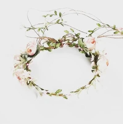 A floral hair crown on a plain wall